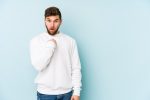 young caucasian man surprised pointing with finger smiling broadly 1187 85025